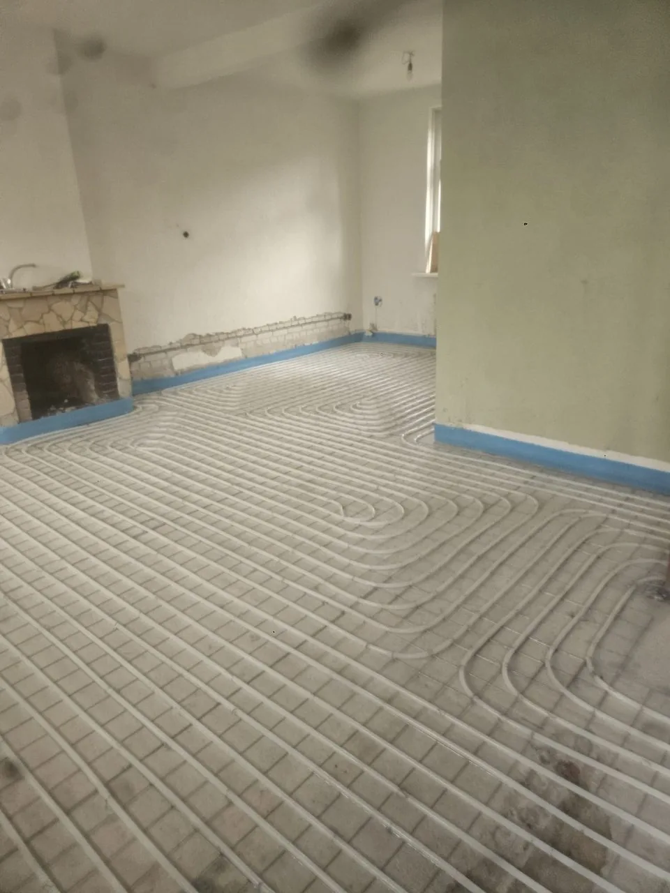 Voor: Woonkamer: vloerverwarming op de wapening